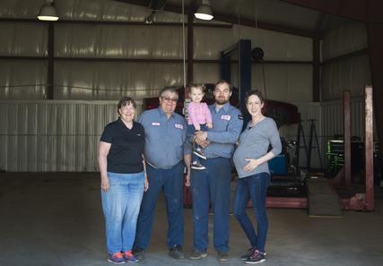 Huigens family group portrait in the shop